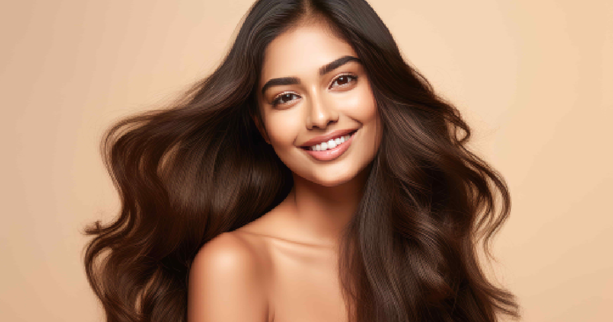 Smiling woman with long, flowing hair and glowing skin representing PRP Injections in Austin, TX