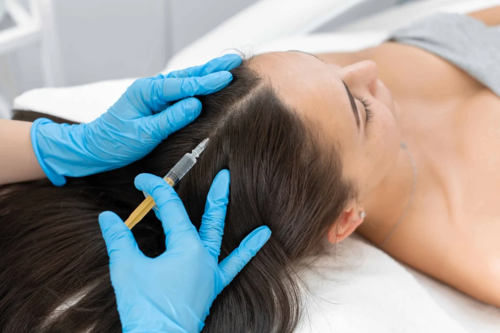 A woman receiving PRP Injections for hair restoration at Glo Med Spa in Austin, TX