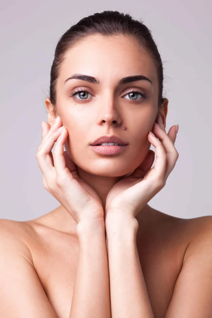 Young female looking beautiful with smooth skin by expert medspa services at Glo Med Spa in Austin, TX